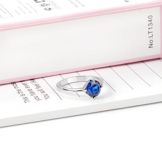 White Gold Plated Blue Stone Crowned Ring